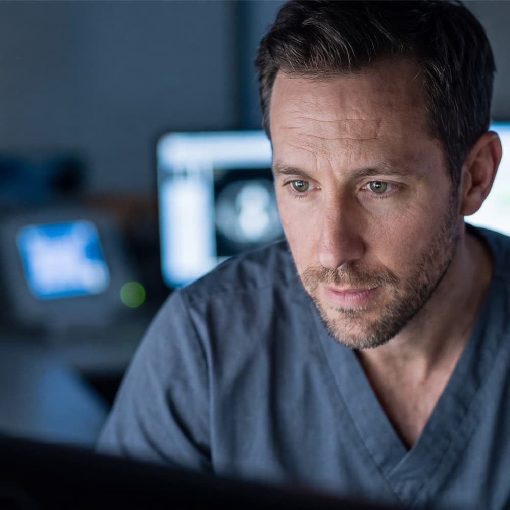Clinician monitoring medical equipment from a workstation