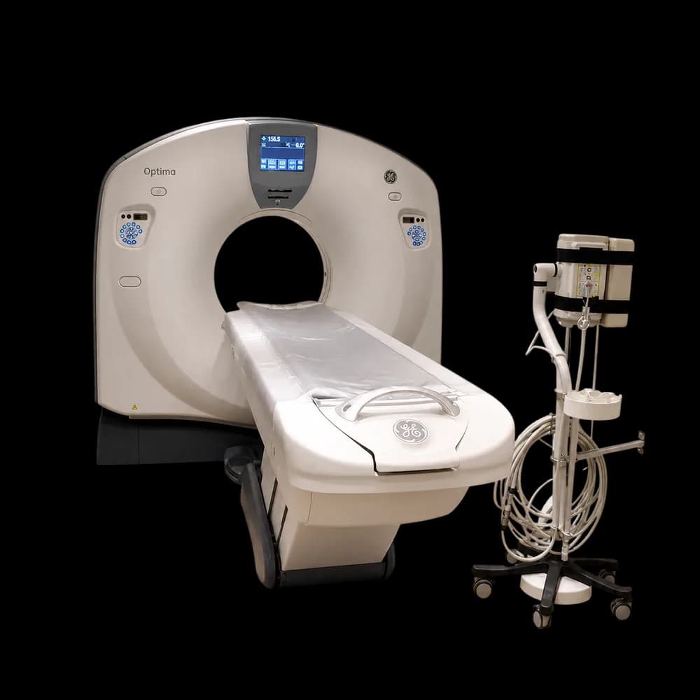 GE Optima 660 CT scanner with patient table and injector cart